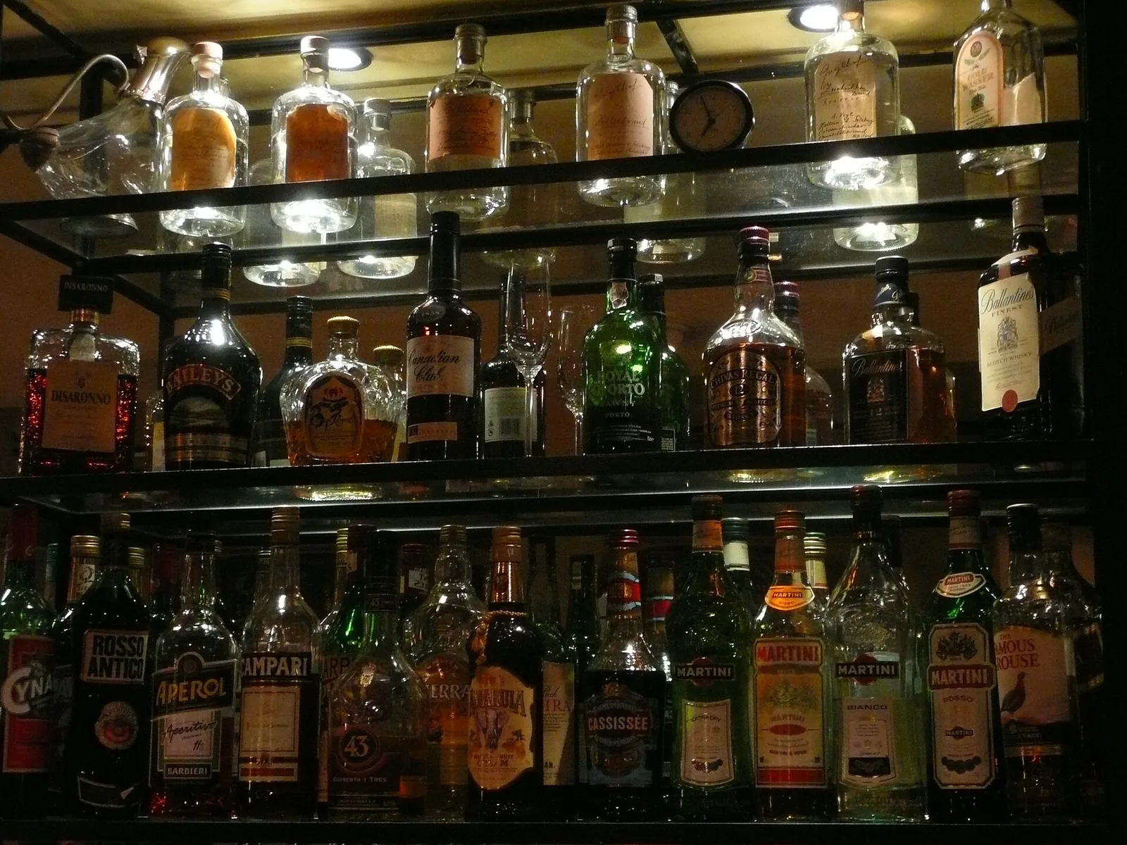 Whisky shelves in the snug, thirty-odd bottles shelved by region